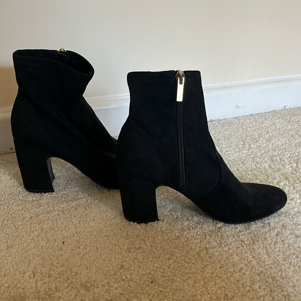 Lightly used black velvet heeled ankle boots with gold accent zipper, size 7.5